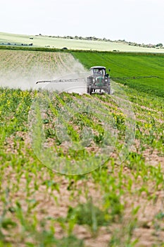 Tractor spraying, agriculture photo
