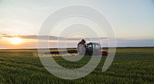 Tractor spraying crops