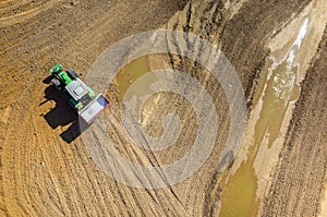 Tractor spraying the fertilizers on the field