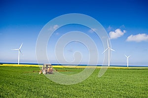 Tractor spraying green field