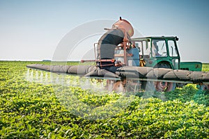 Tractor spraying pesticides