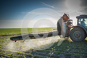 Tractor spraying pesticides