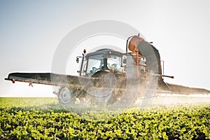 Tractor spraying pesticides