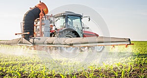 Tractor spraying pesticides