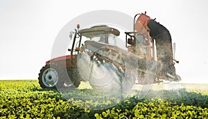 Tractor spraying pesticides