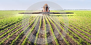 Tractor spraying pesticides