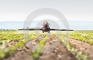 Tractor spraying pesticides