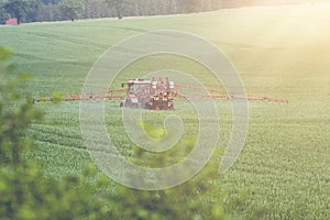 Tractor spraying pesticides