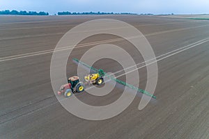 Tractor spraying the pesticides on the field