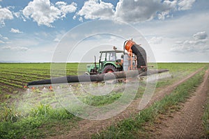 Tractor spraying soy
