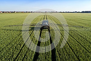 Tractor sprinkling pesticides