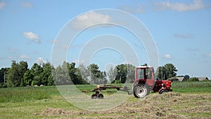 Tractor ted hay field