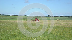 Tractor ted hay field