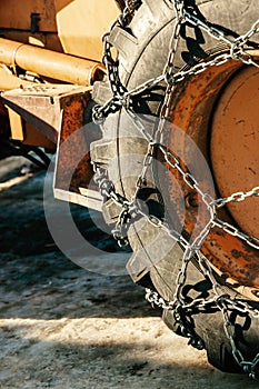 Tractor tire with snow chains