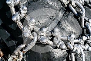 Tractor tires with snow chains with sunlight
