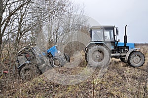 Tractor towing stuck tractor