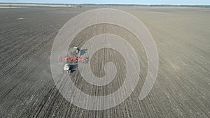 Tractor with trailed agricultural machinery plowing and apply fertilizers 