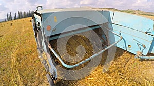 Tractor Trailer Collecting Hay Left By Combine