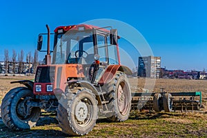 Tractor with trailer in the field