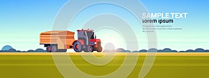 Tractor with trailer heavy machinery working in field smart farming modern technology organization of harvesting concept