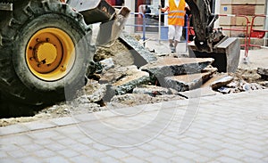 Tractor truck tire on a broken asphal