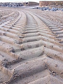 Tractor tyre tracks on the beach