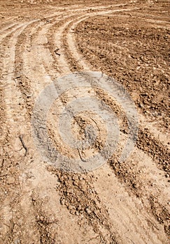 Tractor tyre tracks on the ground