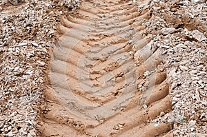 Tractor wheel tracks on the ground