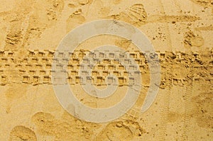 Tractor wheel tracks in the sand