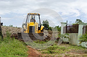 Tractor At Work Leveling Road