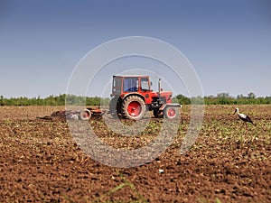 Tractor working farm land