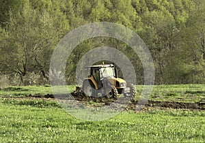 Tractor working at field