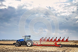 Tractor working in field