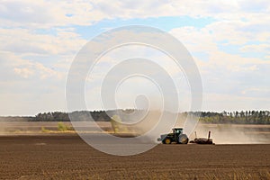 tractor working on the field harvesting