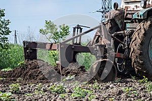 A tractor working in the field of land treatment