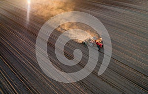 Tractor working in field in spring