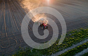 Tractor working in field in spring
