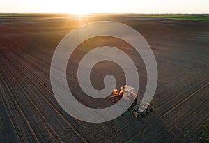 Tractor working in field in spring