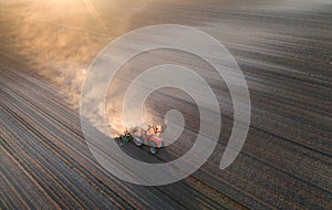 Tractor working in field in spring