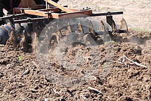 Tractor working in the field. Spring machine work.