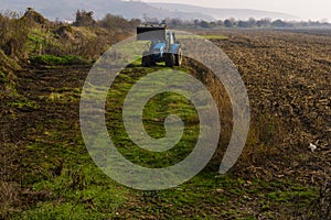 Tractor working in the field on the way to the village of Asparuhovo.