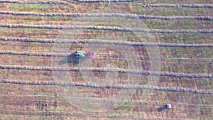 Tractor working in fields aerial view