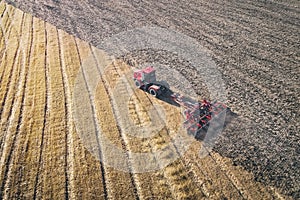 Tractor Working in the Fields, Aerial View, Hay on the field. The view from the top. Tractor harvests dry grass