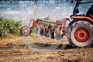 The tractor working on the large field