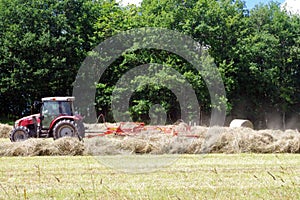 Tractor working in the preparation of a field. Farming background.