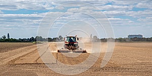 Tractor working on very dry soil.