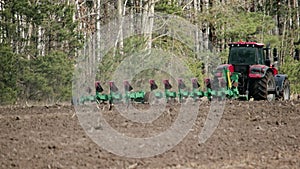 Tractor works with the soil for planting plants. The problem of soil erosion