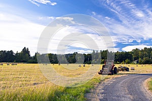 Tractors on the field during the haymaking