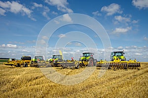 tractors with harrows at the demonstration of agricultural machinery