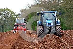 Tractors ploughing